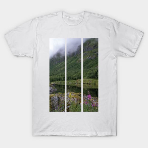 Wonderful landscapes in Norway. Senja, Nordland. Beautiful scenery of a valley with lupine flowers on the rocks. Mirror in the lake. Cloudy summer day. Fog and mountains in background (vertical) T-Shirt by fabbroni-art